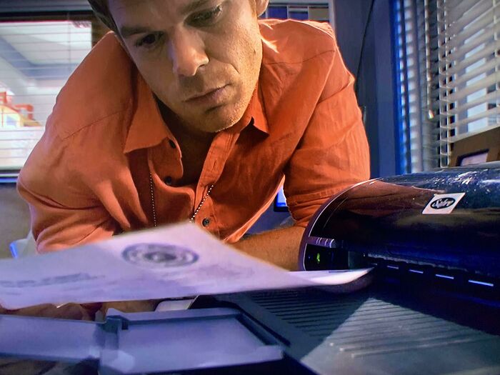 In S6 E5 (2011) Of Dexter You Can See Dexter Using A Sabre Brand Printer. The Same Brand And Company That Buys Dunder Mifflin In The Office S6 (2009)