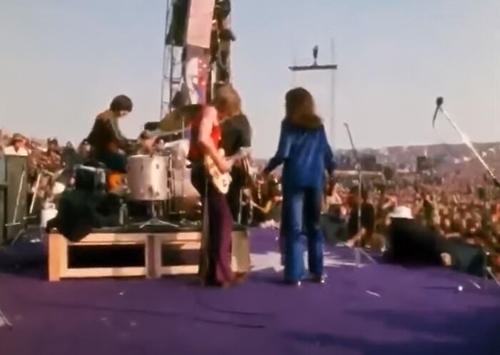 A band performing on stage at the Altamont Free Concert, 1969