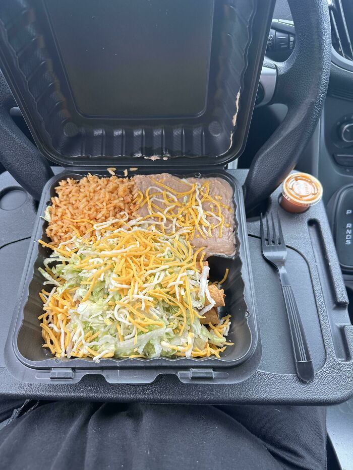 This Tray That Hooks Onto My Steering Wheel, Making A Little Table To Eat Your Lunch
