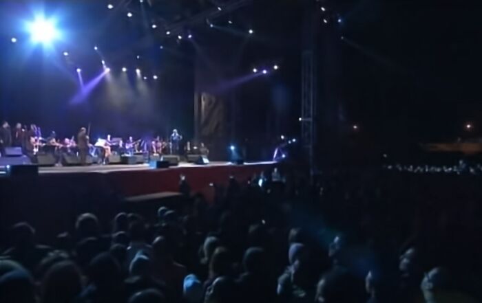 Band on stage and a crowd at nighttime at Mawazine Festival, 2009