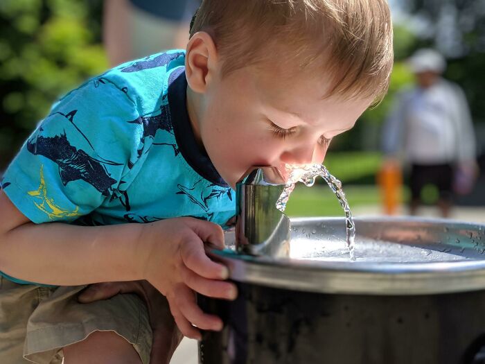 The Way The Sunlight Hit This Water Fountain When My Son Was Taking A Drink