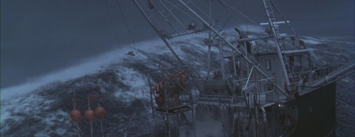 Big wave covering the ship in the sea