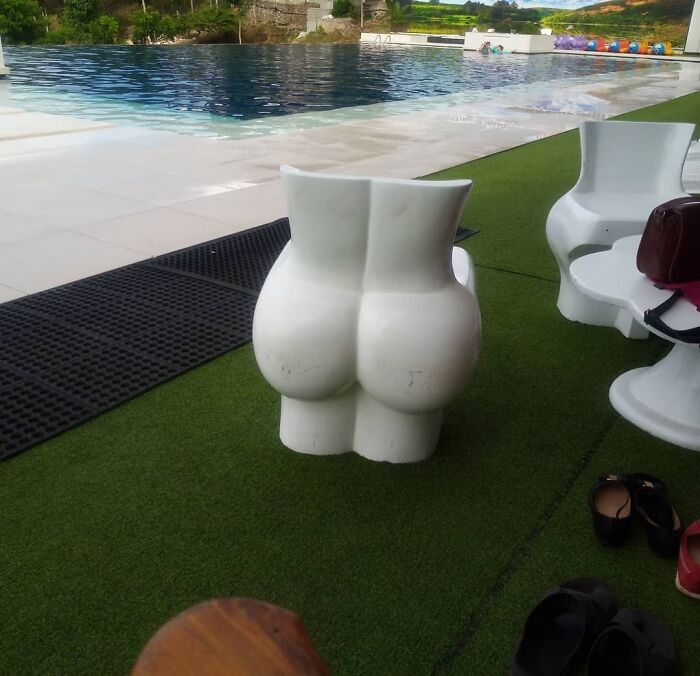 Butt shaped chairs near the pool