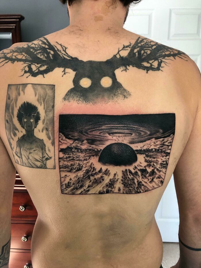 Back with intricate pop culture tattoos featuring dark, artistic designs.