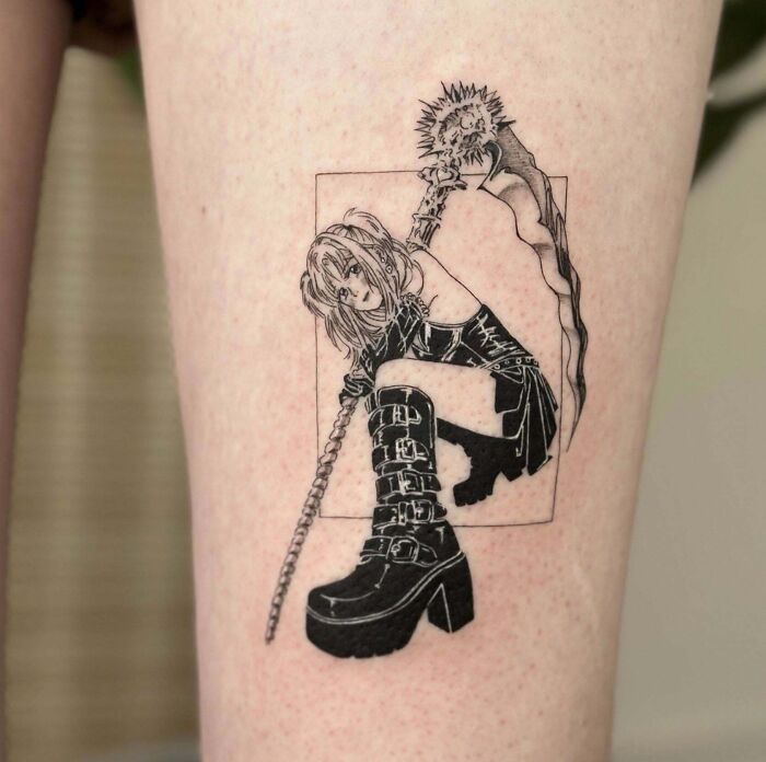Anime character tattoo featuring a detailed, dynamic pose and intricate linework, a pop culture favorite for enthusiasts.