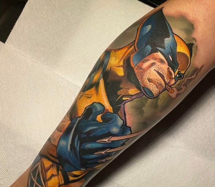 Pop culture tattoo featuring a detailed design of a superhero on an arm.