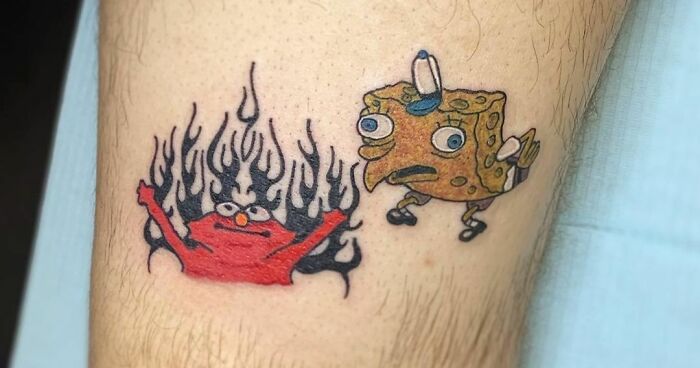Pop culture tattoo featuring a fiery red character and a surprised sponge character on a person's arm.