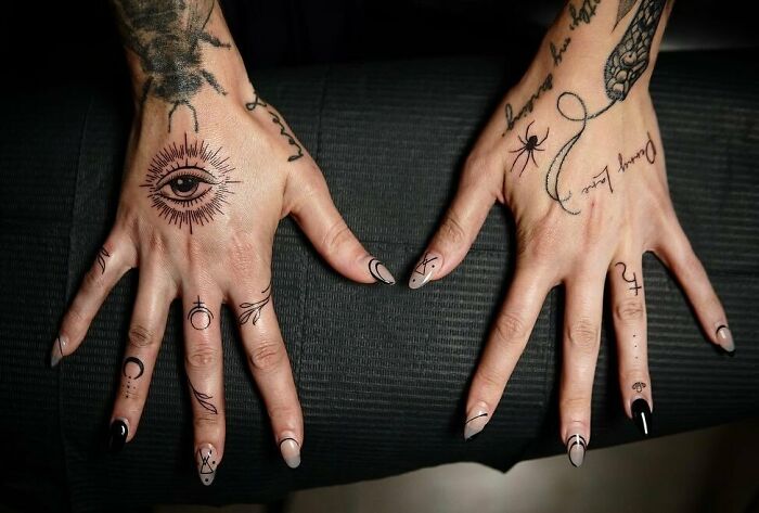 Hand tattoos with eye, spider and symbols