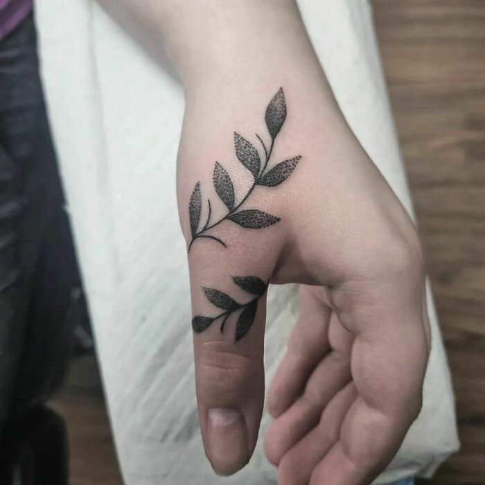 Vine tattoo on the thumb
