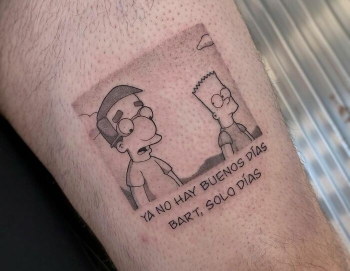 Pop culture tattoo of animated characters with Spanish quote on a person's skin.