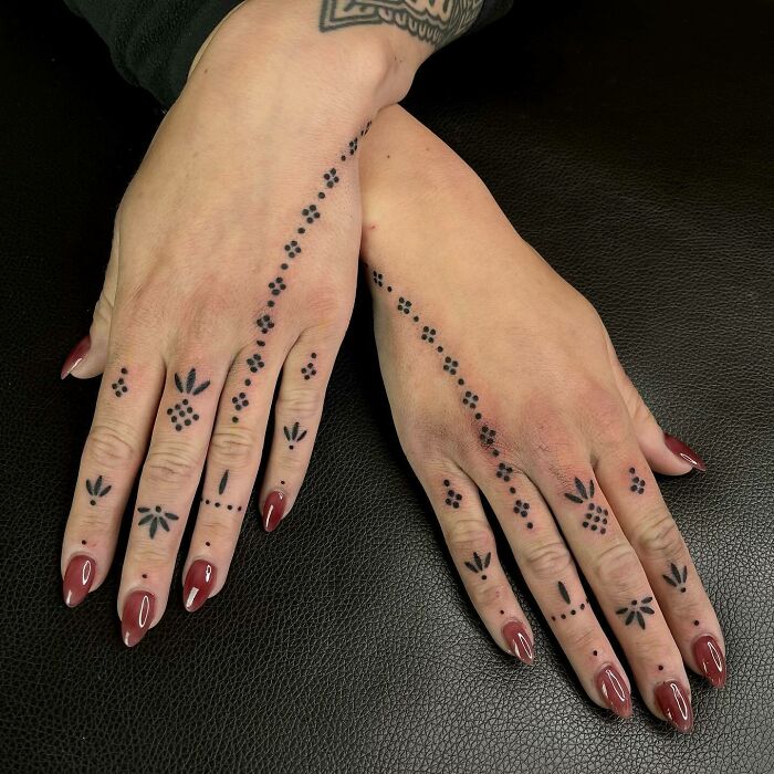 Dots tattoo on hand anf fingers