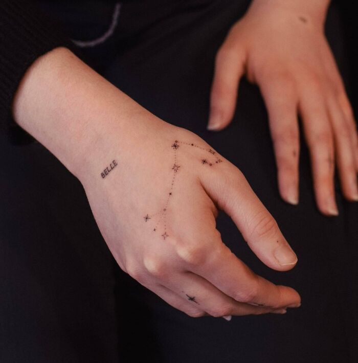 Small constellation tattoo on hand