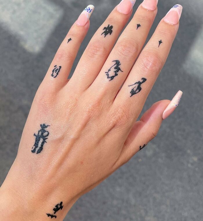 Abstract black small hand and fingers tattoos