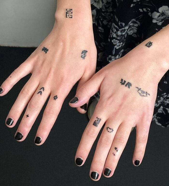 Black abstract minimal hand tattoos