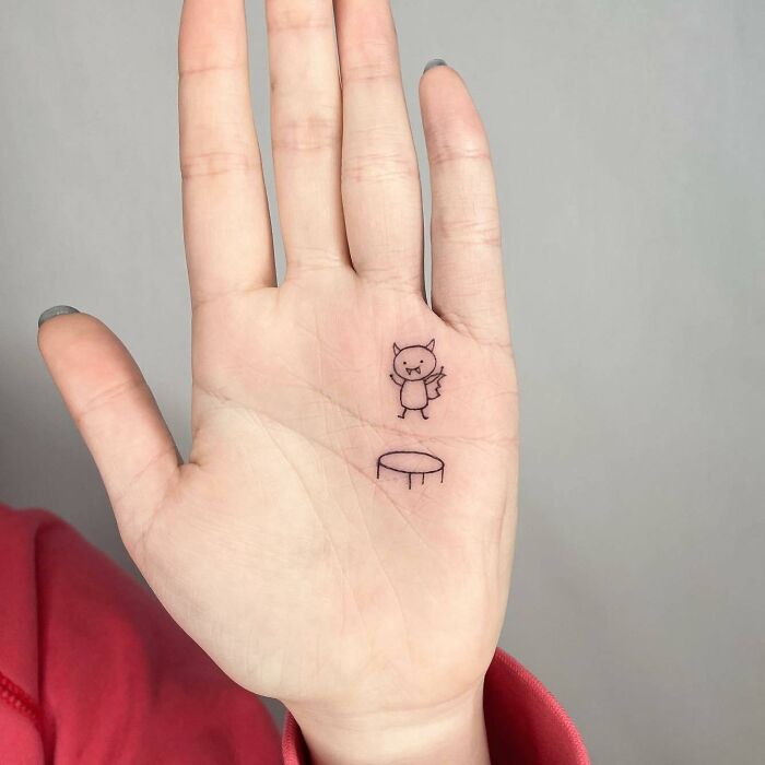 Simple linear vampire jumping on trampoline tattoo on the hand palm