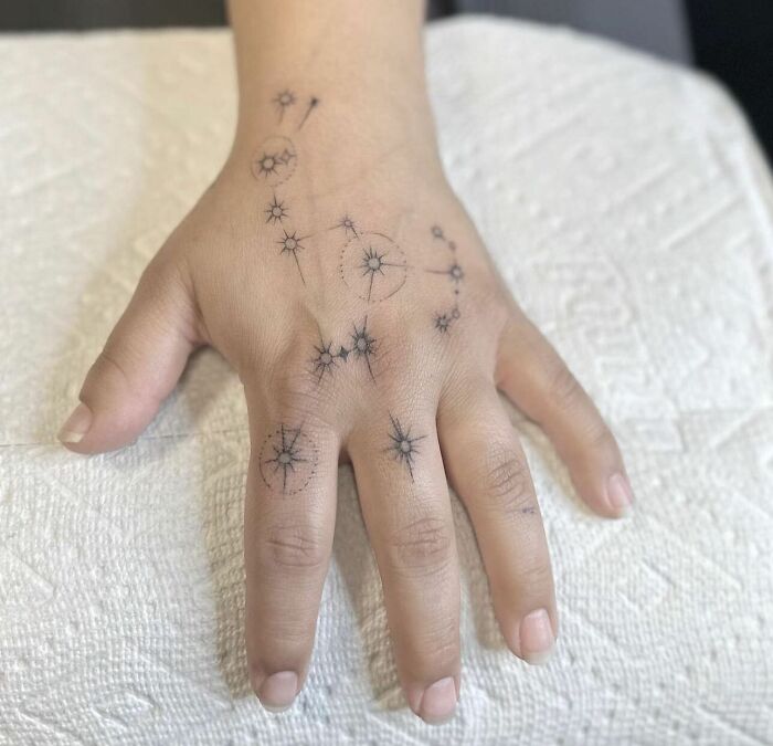 Delicate Orion constellation tattoo on hand
