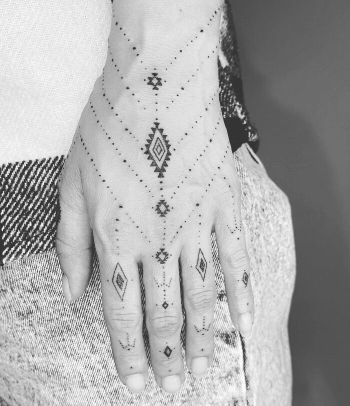 Ornamental hand tattoo