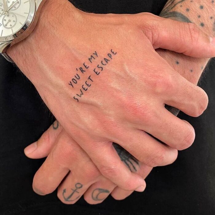 Lettering ‘You’re my sweet escape’ tattoo on hand