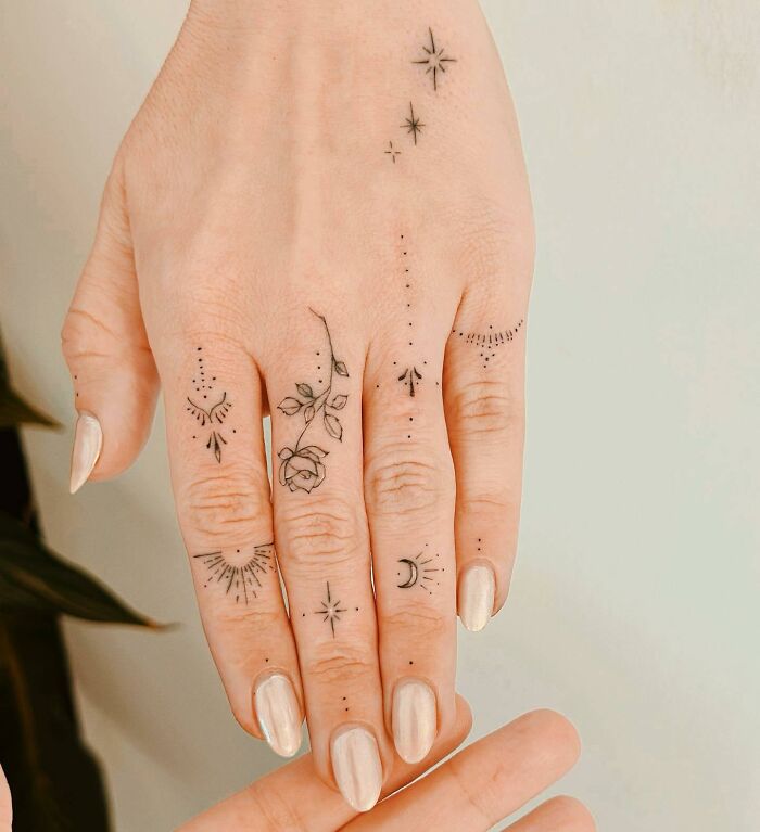 Small ornamental, floral hand and finger tattoos
