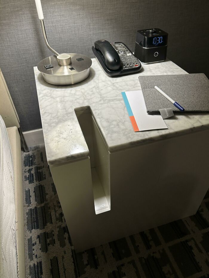 What Is The Purpose Of The Vertical Slot In Hotel Bedside Table?