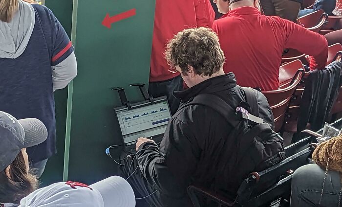 Laptop With Folding Sensors And Wires Going Into A Backpack. They Seem To Be Measuring Something. Saw Multiple People Walking Around With These Setups At A Major League Baseball Game