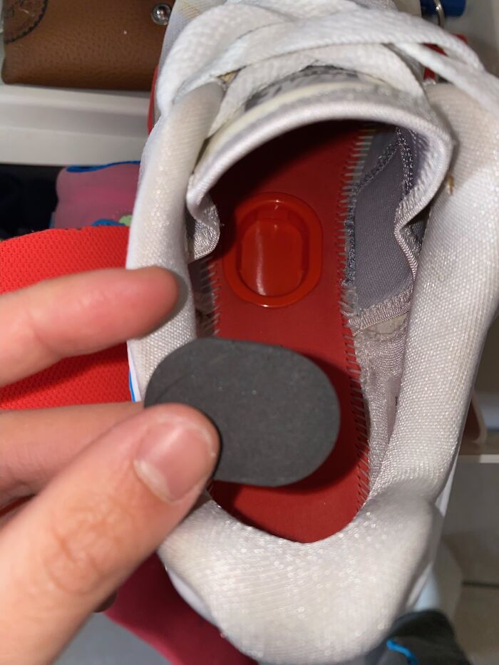 This Plastic Hole Filled With A Foam Insert Underneath Nike Sneaker Sole Insert, Only In The Left Shoe
