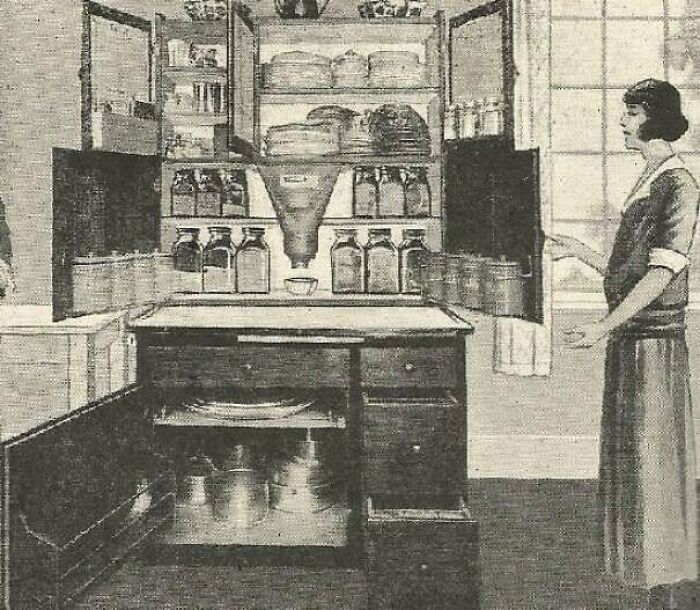 What Are The Built-In Funnel-Like Things In These Early 20th Century Kitchen Cabinets?