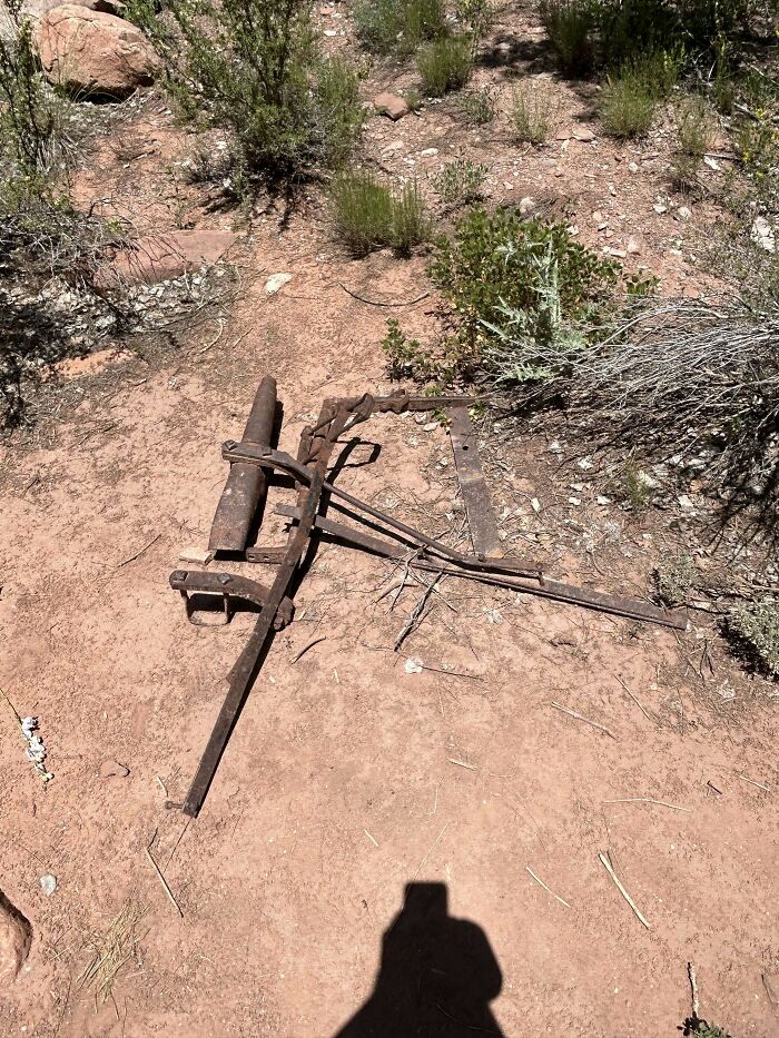 Contraption Found On A Hiking Trail In Utah Made Of Several Flat And Round Pieces Of Metal, Held Together By Screws With A Thicker Hollow Part Running Parallel To The Longest Metal Strip