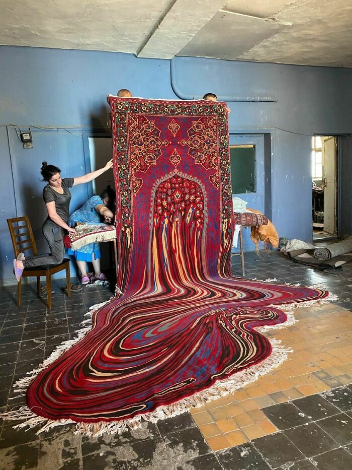 Person holding colorful magic carpet rug