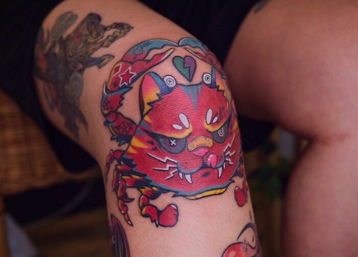 Crab with cat face tattoo