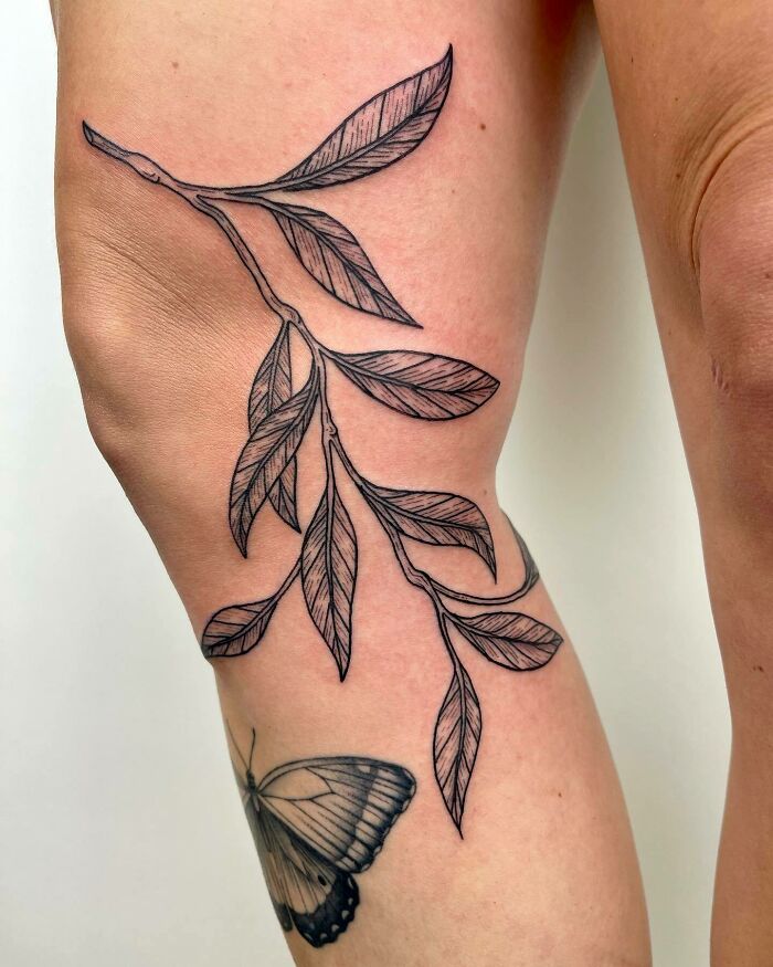 Branch of leaves tattoo 