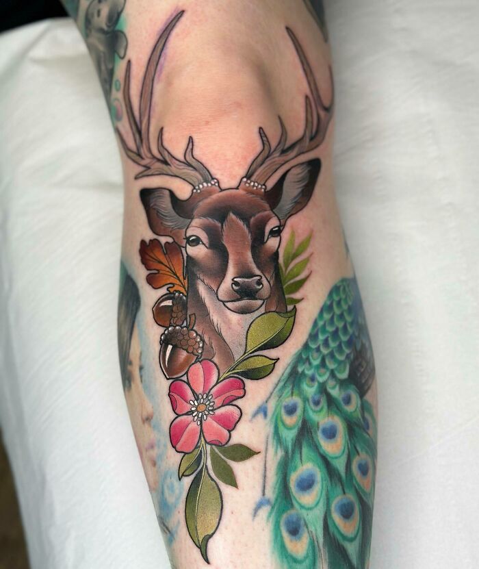 Deer with flowers on the knee tattoo
