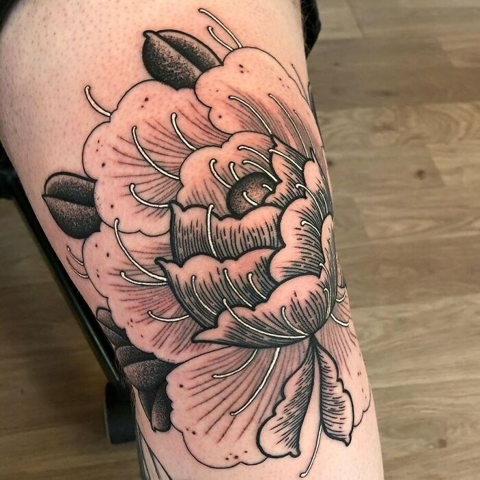 Floral knee tattoo design with intricate detailing.