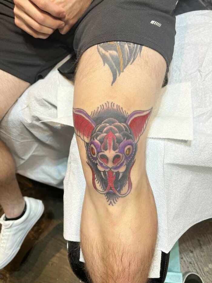 Bat's head with tongue out tattoo