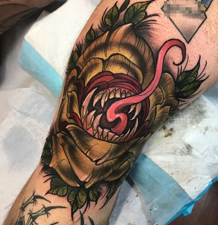 Angry plant with teeth and tongue tattoo