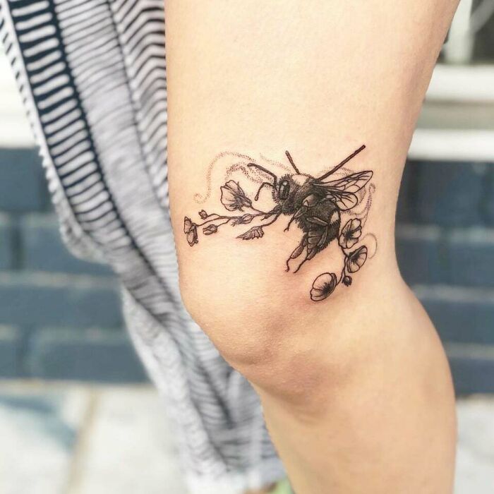Bee with flowers tattoo 