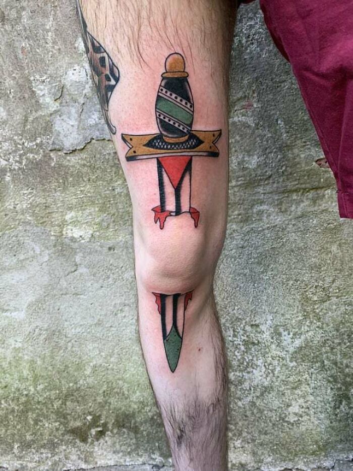 Dagger through the knee tattoo 