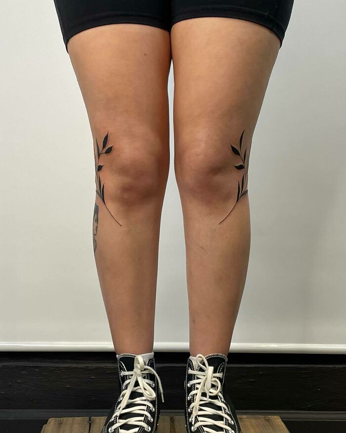 Leaves beside both knees tattoos