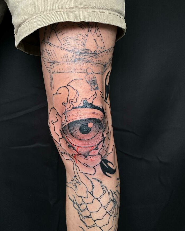 Eye inside flower tattoo 