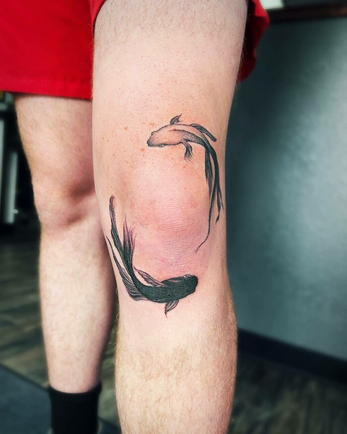 Fishes around the knee tattoo 