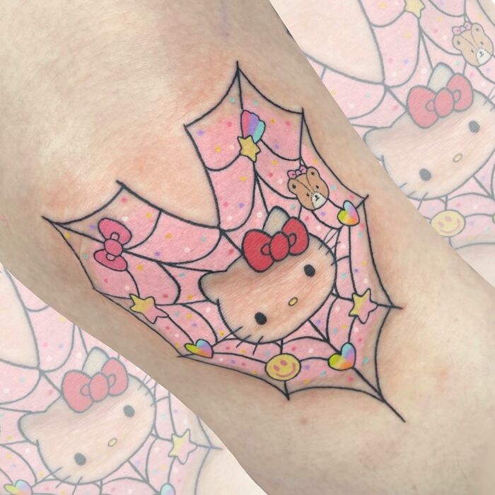 Pink Hello Kitty web tattoo
