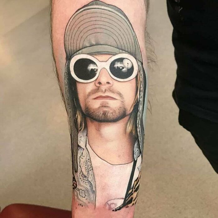Kurt Cobain with sunglasses and hat arm tattoo