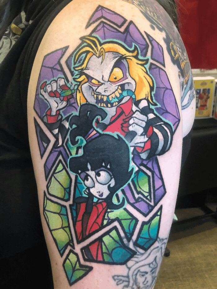 colorful Beetlejuice & Lydia arm tattoo