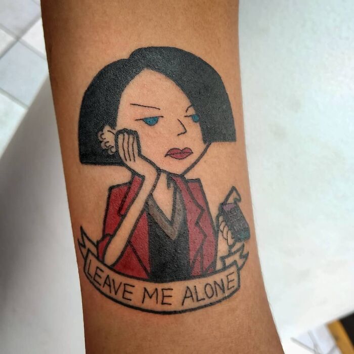 Leave Me Alone woman wearing red shirt arm tattoo