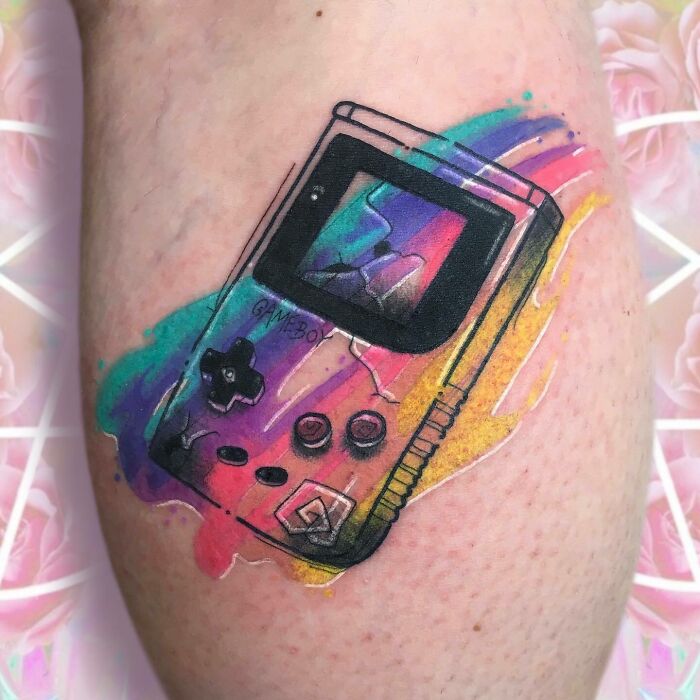 colorful broken Gameboy leg tattoo