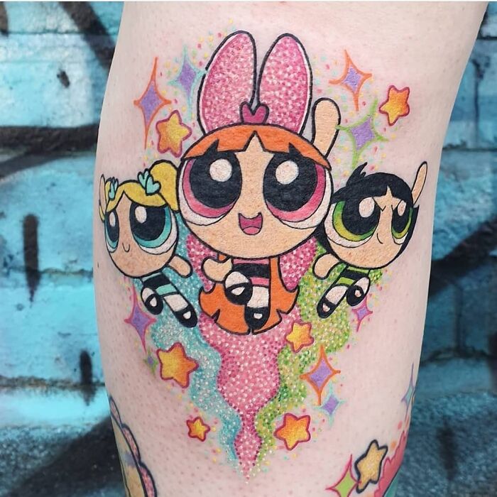 colorful Powerpuff Girls arm tattoo