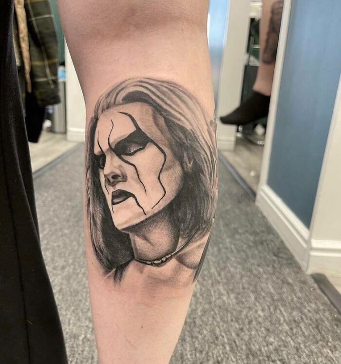 sad Sting wearing make up arm tattoo