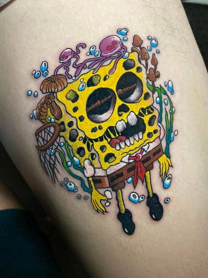 Dead yellow Spongebob with jellyfish in the water tattoo