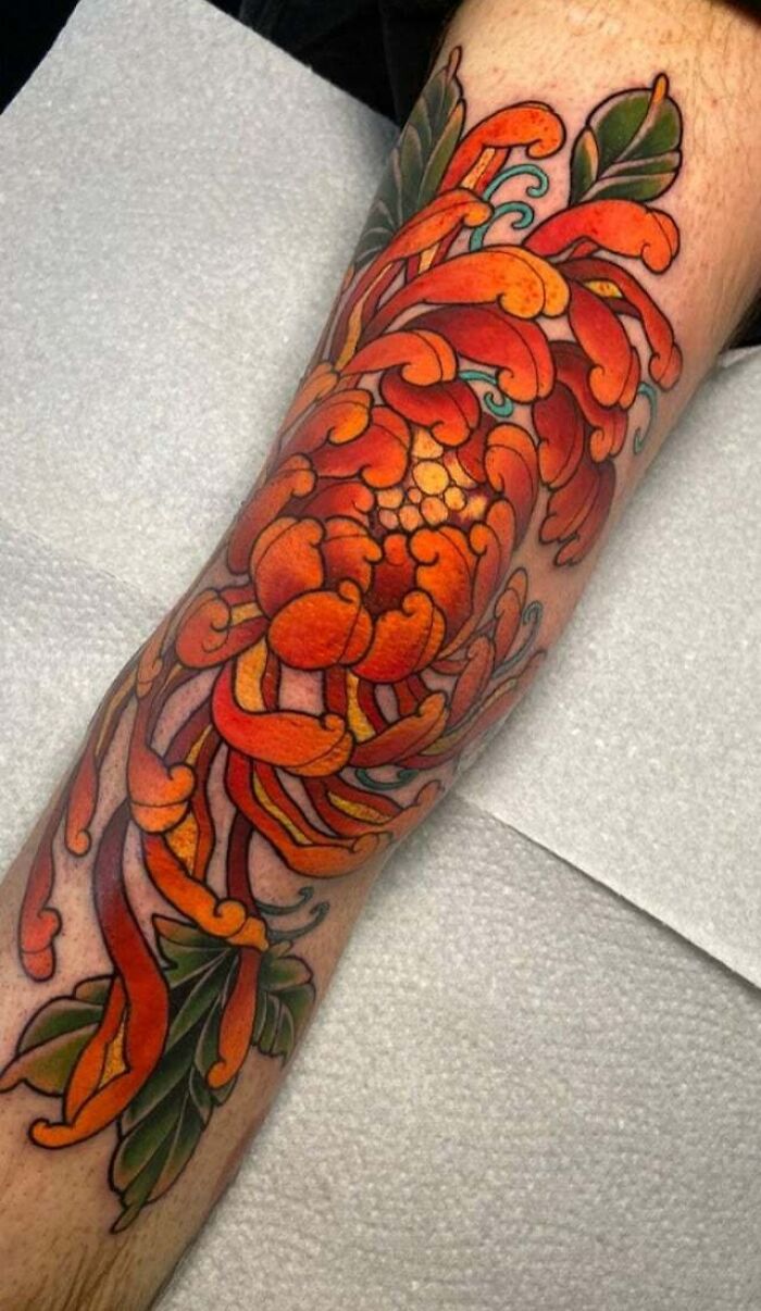 Red flower tattoo 