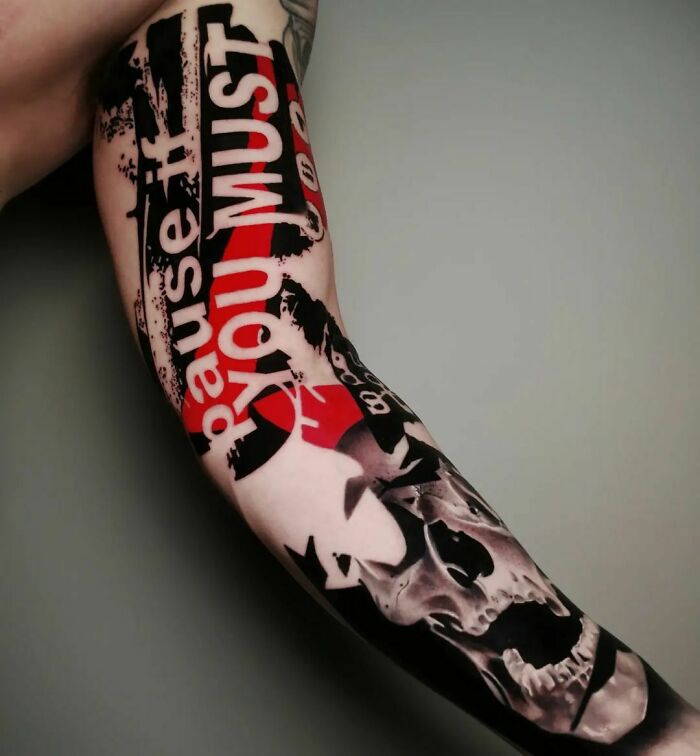 Trash Polka tattoo design featuring bold black and red elements with text on forearm.